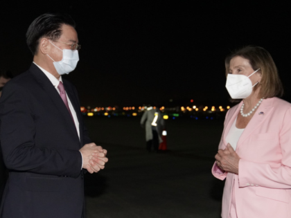TAIPEI, TAIWAN - AUGUST 2: (----EDITORIAL USE ONLY - MANDATORY CREDIT - "TAIWANESE FOREIGN MINISTRY / HANDOUT" - NO MARKETING NO ADVERTISING CAMPAIGNS - DISTRIBUTED AS A SERVICE TO CLIENTS----) US House Speaker Nancy Pelosi (R) being welcomed by Taiwanese Foreign Minister Joseph Wu (L) after landing at Songshan Airport …