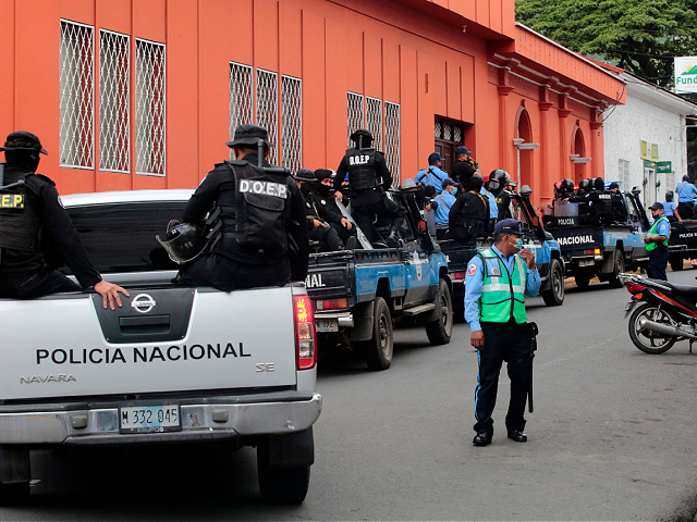 Police and MAT patrol outside the Archbishop Curia of Matagalpa preventing Monsignor Rolando Alvarez from leaving, in Matagalpa, Nicaragua, on August 4, 2022. - Riot police on Thursday prevented Nicaraguan Bishop Rolando Alvarez from leaving the church building to preside over a function as part of a "prayer crusade" carried out by the church, following the closure of several Catholic media outlets and complaints of harassment.  (Photo by AFP) (Photo by STR/AFP via Getty Images)