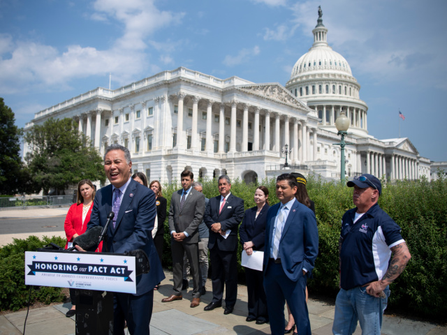 UNITED STATES - May 26: Rep. Mark Takano, D-Calif., speaks during a news conference with other members of the House Veterans Affairs Committee to unveil legislation to expand benefits and improve care for veterans suffering from toxic exposure to burn pits and other hazards, in Washington on Wednesday, May 26, …