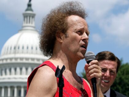 WASHINGTON - JULY 24: Fitness advocate Richard Simmons (L) speaks during a rally on Capito