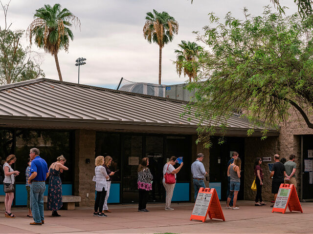 Voters line up at a polling location at Indian Bend Wash Visitors Center in Scottsdale, Arizona, US, on Tuesday, Aug. 2, 2022. Donald Trump endorsed venture capitalist Blake Masters in the crowded Aug. 2 GOP primary for the US Senate in Arizona, a nod that could offer a significant edge …