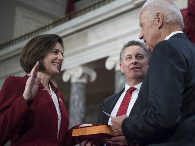 Sen. Catherine Cortez Masto, D-Nev., is administered an oath as her husband Paul looks on, by Vice President Joe Biden during a swearing-in ceremony in the Capitol's Old Senate Chamber, January 03, 2017. (Tom Williams/CQ Roll Call)