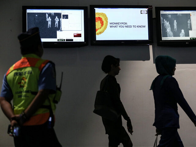 Some passenger from Singapore check body temperature with thermometer infrared by security health worker airport in Soekarno-Hatta International Airport, Jakarta, Indonesia, on May 15, 2019. Singapore announced last week it has detected the first case of monkeypox in the country. A Nigerian visiting the tiny island nation on Apr. 28 …