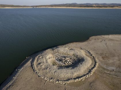 Spain Battles Extreme Drought During Prolonged Dry Spell CACERES, SPAIN - JULY 28: The Dolmen of Guadalperal, sometimes also known as "The Spanish Stonehenge" is seen above the water level at the Valdecanas reservoir, which is at 27 percent capacity, on July 28, 2022, in Caceres province, Spain. Some areas …