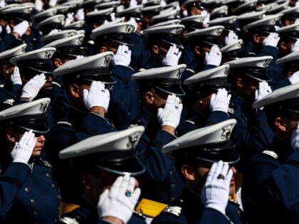 COLORADO SPRINGS, CO - MAY 25: Air Force Academy cadets salute during the national anthem at Falcon Stadium for their graduation ceremony on May 25, 2022 in Colorado Springs, Colorado. United States Secretary of Defense Lloyd Austin III gave the commencement address to the 973 graduates from the academy. (Photo …