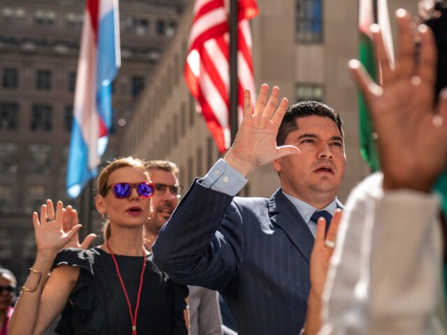 NEW YORK, NY - SEPTEMBER 17: New U.S. citizens recite the the Oath of Allegiance during a naturalization ceremony at Rockefeller Center on September 17, 2019 in New York City. Hailing from 33 different countries, 50 people officially became new U.S. citizens at the ceremony. (Photo by Drew Angerer/Getty Images)