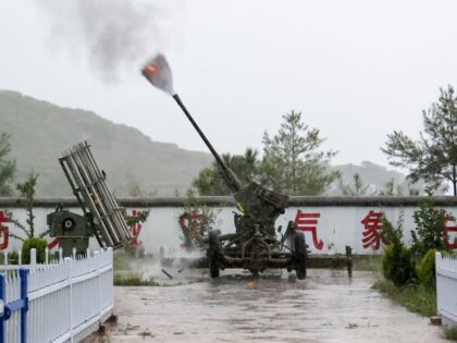 WEINING, CHINA - AUGUST 24, 2022 - Citizens use rocket anti-aircraft guns to make artifici