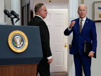 President Joe Biden responds to a question about student loan debt forgiveness before leav