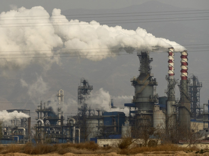 In this Nov. 28, 2019, file photo, smoke and steam rise from a coal processing plant in Hejin in central China's Shanxi Province. The International Energy Agency said Wednesday that emissions of planet-warming methane from oil, gas and coal production are significantly higher than governments claims. The countries with the …