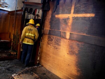 Los Angeles, CA - February 06: A cross removed by firefighters left an imprint inside the church as Los Angeles City firefighters look over the aftermath of a fire at St. Johns United Methodist Church Sunday, Feb. 6, 2022 in Los Angeles, CA. (Brian van der Brug / Los Angeles …