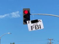 Street Artist Sabo Hangs 'F*ck the FBI' and 'Trump 2024 MAGA' Signs