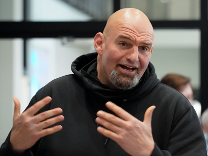 Pennsylvania Lt. Gov. John Fetterman visits with people attending a Democratic Party event for candidates to meet and collect signatures for ballot petitions for the upcoming Pennsylvania primary election, at the Steamfitters Technology Center in Harmony, Pa., March 4, 2022. The fate of the Democratic Party is intertwined in a …