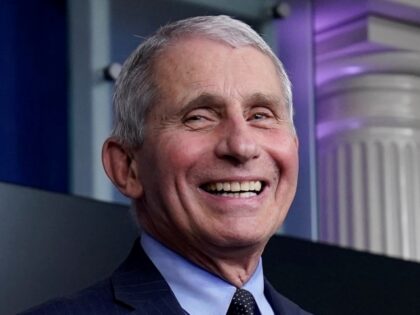 Dr. Anthony Fauci, director of the National Institute of Allergy and Infectious Diseases, laughs while speaking in the James Brady Press Briefing Room at the White House, Thursday, Jan. 21, 2021, in Washington. (AP Photo/Alex Brandon)
