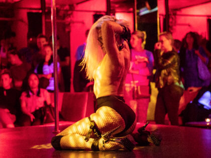 15 August 2019, Hessen, Frankfurt/Main: A stripper dances in the table dance club "Pure Platinum" on stage during the station quarter night. Every year the Frankfurters celebrate the railway station district with the street festival. (to dpa "Frankfurt celebrates station quarter with big street festival") Photo: Boris Roessler/dpa (Photo by …