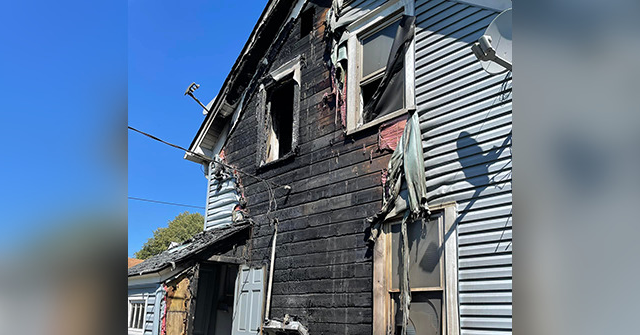 PHOTO: Officer Kicks Door Open to Save Children from House Fire