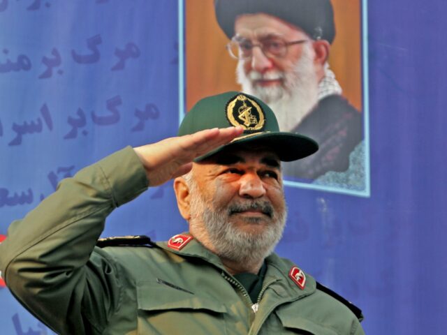Iranian Revolutionary Guards commander Major General Hossein Salami salutes the crowd duri