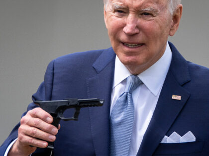 WASHINGTON, DC - APRIL 11: U.S. President Joe Biden holds up a ghost gun kit during an event about gun violence in the Rose Garden of the White House April 11, 2022 in Washington, DC. Biden announced a new firearm regulation aimed at reining in ghost guns, untraceable, unregulated weapons …