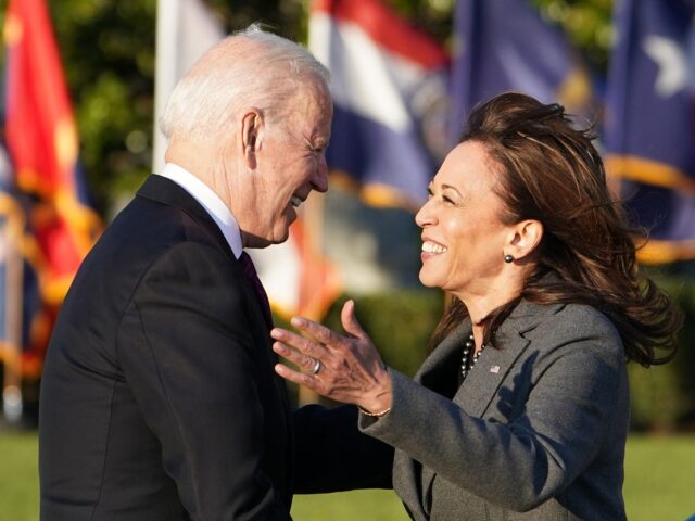 US Vice President Kamala Harris hugs US President Joe Biden during a signing ceremony for