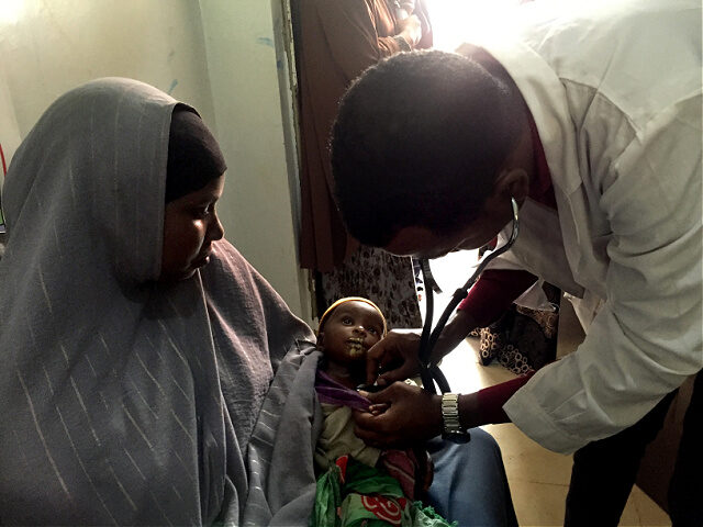 29 June 2022, Somalia, Baidoa: A doctor at a clinic in Baidoa in southwestern Somalia exam