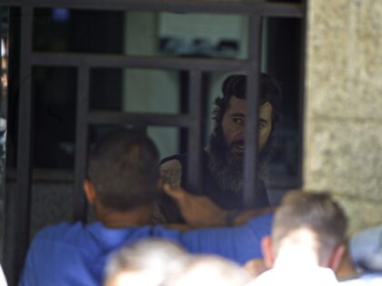 BEIRUT, LEBANON - AUGUST 11: A Lebanese gunman (C) takes an unspecified number of hostages