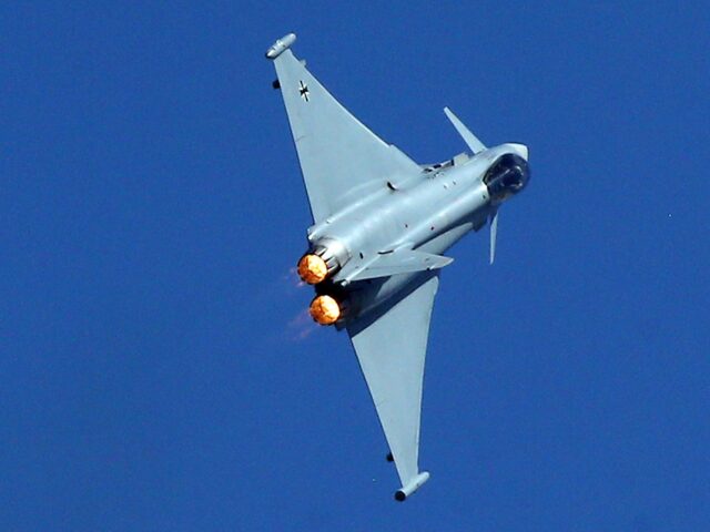 21 June 2022, Brandenburg, Schönefeld: A Eurofighter of the German Air Force demonstrates