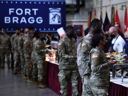 US President Joe Biden and First Lady Jill Biden serve food to soldiers at Fort Bragg to mark the upcoming Thanksgiving holiday on November 22, 2021, in Fort Bragg, North Carolina. (Photo by Brendan Smialowski / AFP) (Photo by BRENDAN SMIALOWSKI/AFP via Getty Images)