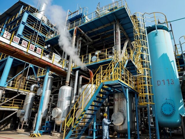 HUAI'AN, CHINA - AUGUST 1, 2022 - A worker inspects oil refining production line equipment in Huai 'an, Jiangsu province, China, Aug 1, 2022. The company has 14 sets of production units, such as special oil pretreatment unit, catalytic cracking unit and gasoline hydrogenation unit. Based on crude oil processing, …
