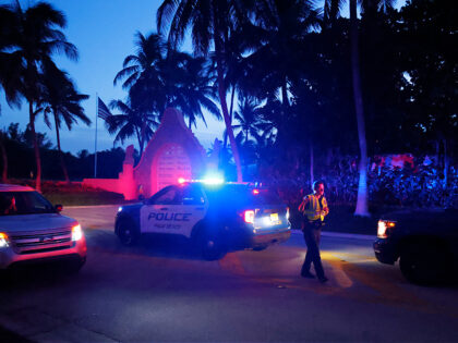 Police direct traffic outside an entrance to former President Donald Trump's Mar-a-Lago estate, Monday, Aug. 8, 2022, in Palm Beach, Fla. Trump said in a lengthy statement that the FBI was conducting a search of his Mar-a-Lago estate and asserted that agents had broken open a safe. (AP Photo/Terry Renna)
