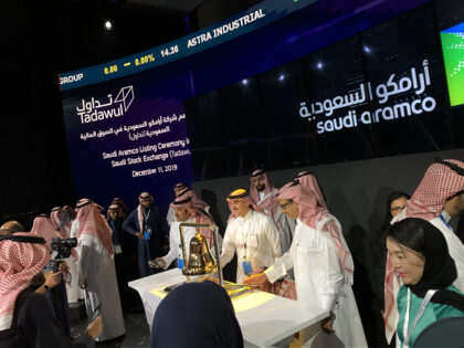 Participants ring the bell to mark the initial public offering (IPO) of Saudi Aramco at the Fairmont Hotel in Riyadh, Saudi Arabia, on Wednesday, Dec. 11, 2019. Saudi Aramco shares surged after its initial public offering, valuing the oil producer at a record $1.88 trillion and lifting Saudi Arabias stock …