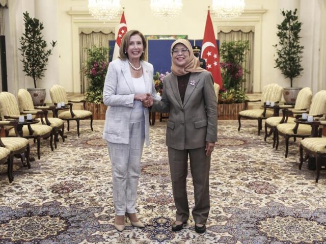 In this photo provided by Ministry of Communications and Information, Singapore, U.S. House Speaker Nancy Pelosi, left, and Singapore President Halimah Yacob shake hands at the Istana Presidential Palace in Singapore, Monday, Aug. 1, 2022. Pelosi arrived in Singapore early Monday, kicking off her Asian tour as questions swirled over …