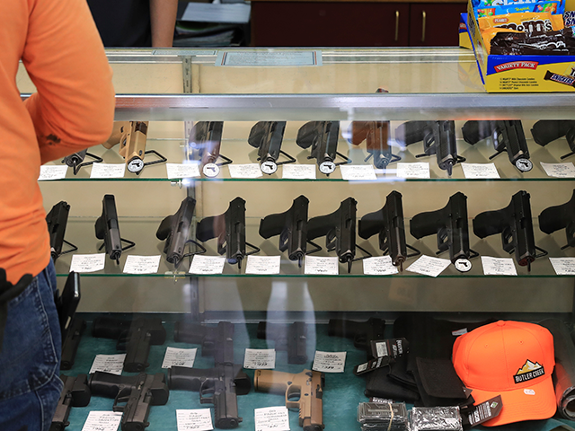 Handguns are on displayed at a gun shop, Thursday, June, 23, 2022 in Honolulu. (AP Photo/Marco Garcia)