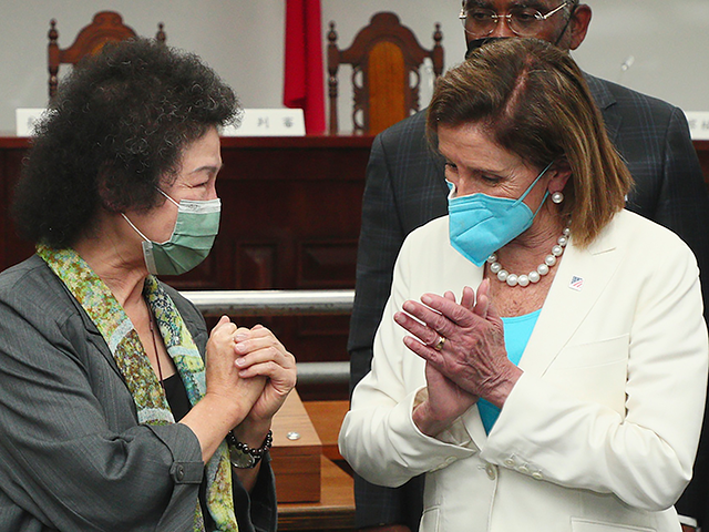 In this photo released by the Taiwan Ministry of Foreign Affairs, U.S. House Speaker Nancy Pelosi at right reacts to Chen Chu, the President of the Control Yuan and Chair of the National Human Rights Commission, during a visit to a human rights museum in Taipei, Taiwan on Wednesday, Aug. …