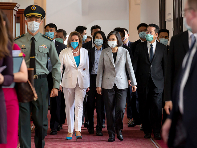 In this photo released by the Taiwan Presidential Office, U.S. House Speaker Nancy Pelosi, center left, and Taiwanese President President Tsai Ing-wen arrive for a meeting in Taipei, Taiwan, Wednesday, Aug. 3, 2022. U.S. House Speaker Nancy Pelosi, meeting top officials in Taiwan despite warnings from China, said Wednesday that …