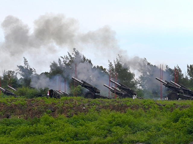 Taiwan military soldiers fire the 155 mm Howitzer during a live fire anti landing drill in