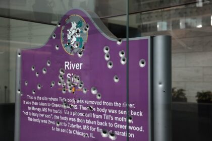 A bullet-riddled sign marking where police recovered the body of 14-year-old Emmett Till is displayed in the the Museum of American History in Washington, DC