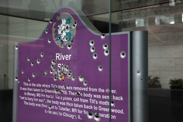 A bullet-riddled sign marking where police recovered the body of 14-year-old Emmett Till