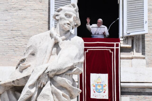 Pope Francis waves from the window of the apostolic palace on August 21, 2022 during the w