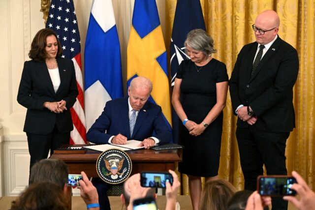 President Joe Biden flanked by Vice President Kamala Harris and the ambassadors of Sweden