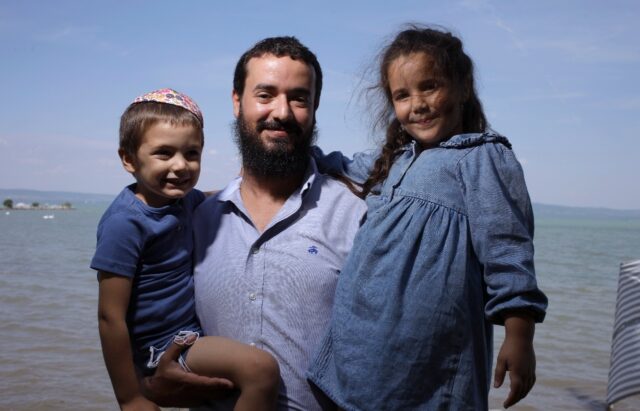 Safe at last: rabbi Yaakov Goldstein with his children. He helped bring Ukrainian Jews to