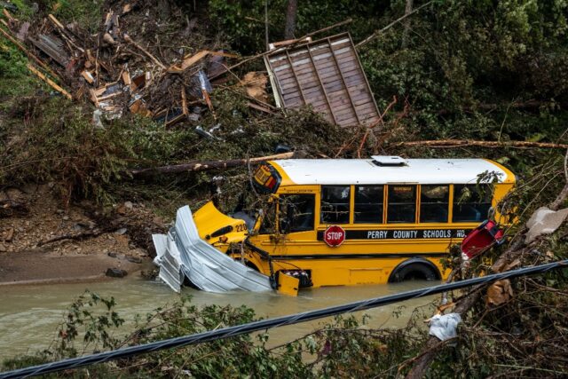 A school bus and other debris sits in a creek near Jackson, Kentucky after devastating fla