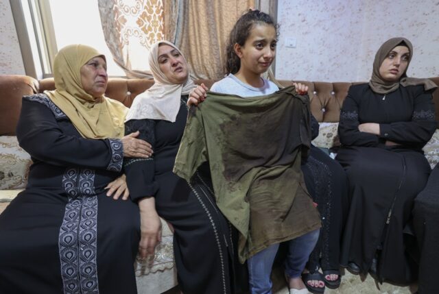 The sister of Palestinian Mohammed al-Shaham, 21, who was killed during an Israeli raid, h
