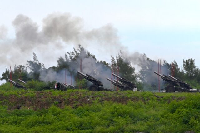 Taiwanese soldiers fire howitzers during a live-fire anti-landing drill in Pingtung county