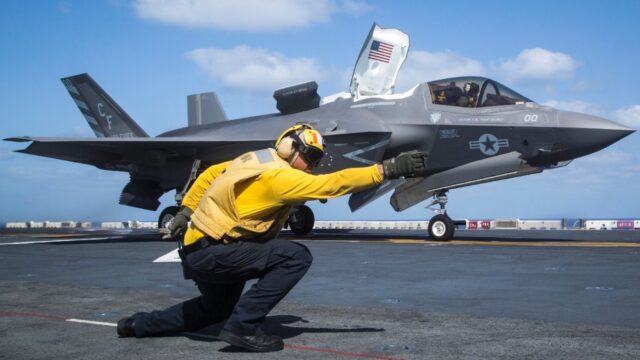 US Navy serviceman with the Essex Amphibious Ready Group (ARG) launches an F-35B Lightning