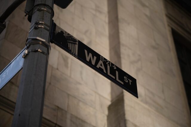 A general view shows a Wall Street sign outside the New York Stock Exchange (NYSE) in New