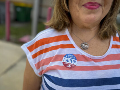 A voter wears an "I Voted" sticker at a polling location in Miami, Florida, US, on Tuesday, Aug. 23, 2022. Republican Florida Governor Ron DeSantis, running unopposed in Tuesday's primary as he goes for a second term, has amassed $142 million from the start of 2021 through August 5 this …
