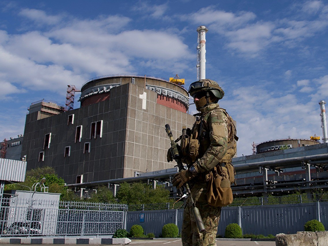 A Russian serviceman patrols the territory of the Zaporizhzhia Nuclear Power Station in Energodar on May 1, 2022. - The Zaporizhzhia Nuclear Power Station in southeastern Ukraine is the largest nuclear power plant in Europe and among the 10 largest in the world. *EDITOR'S NOTE: This picture was taken during …