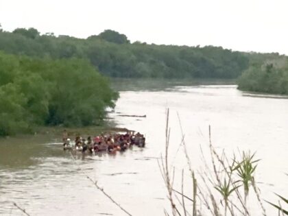 A group of 50 migrants attempts to cross the swiftly moving Rio Grande on September 1. (Photo; U.S. Border Patrol/Del Rio Sector)