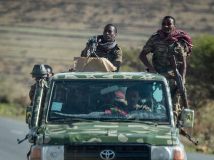 Ethiopian government soldiers ride in the back of a truck on a road near Agula, in the Tigray region of northern Ethiopia Saturday, May 8, 2021. As the Tigray People’s Liberation Front and the government forces fight, civilians, and especially children, are suffering heavily. More and more children are caught …