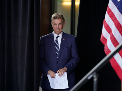 Rep. Don Beyer, D-Va., listens as Virginia Gov. Ralph Northam speaks at a campaign event for Virginia democratic gubernatorial candidate Terry McAuliffe at Lubber Run Park, Friday, July 23, 2021, in Arlington, Va. (AP Photo/Andrew Harnik)
