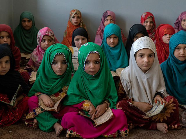 Afghan girls read the Quran in the Noor Mosque outside the city of Kabul, Afghanistan, Wed